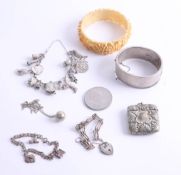 A silver charm bracelet and another, silver bangle, white metal vesta etc.