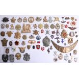 A collection of approx. 75 military cap and other badges of foreign and overseas forces including