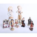 A pair of German porcelain figures, a Doulton small Dickensian figure, Portia figure and other