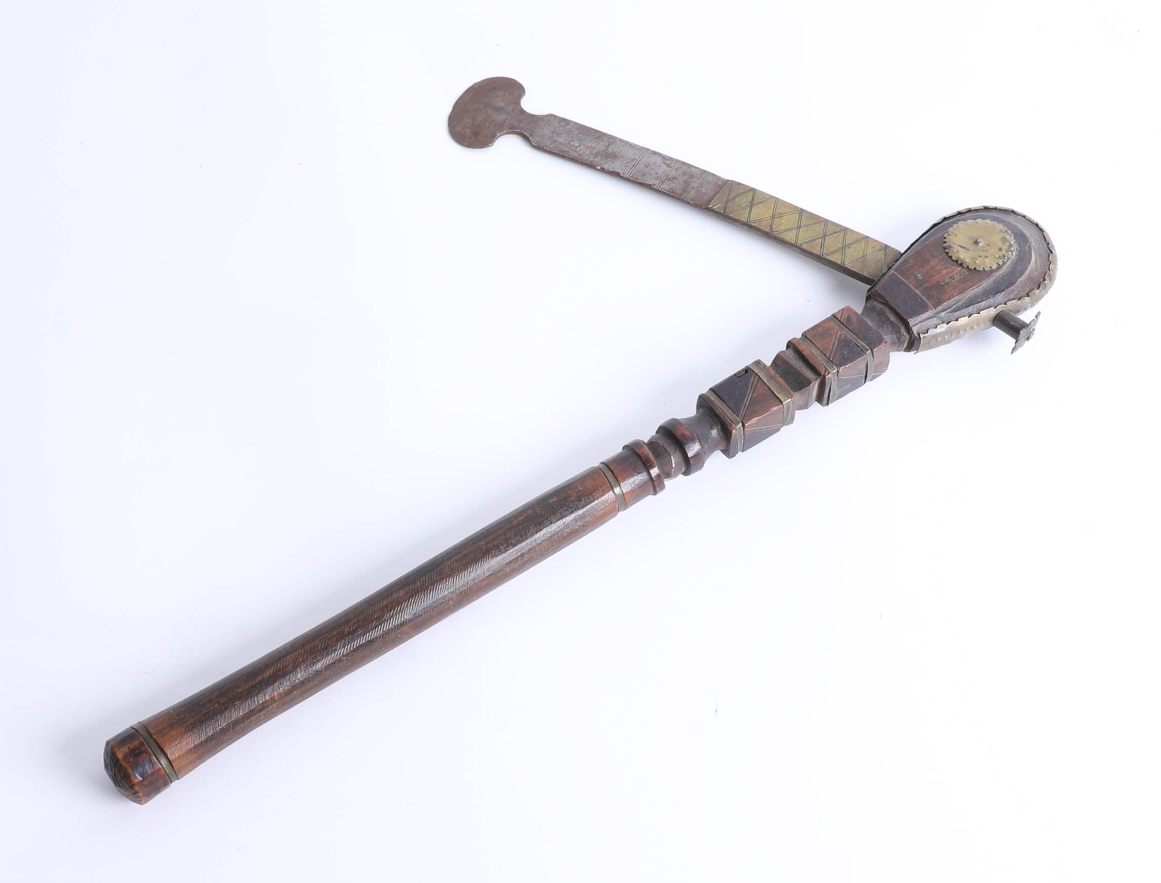 An unusual carved wood and steel axe with brass mounts, length 42cm. Part of the Late Reverend