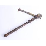 An unusual carved wood and steel axe with brass mounts, length 42cm. Part of the Late Reverend
