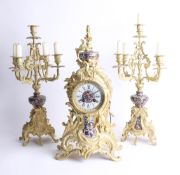 Three piece clock garniture set, with gilt casings and enamel decoration, movement signed 'Japy