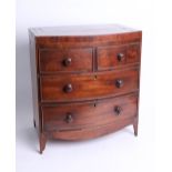 A miniature mahogany bow front chest, fitted with two short and two long drawers on splayed