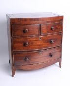 A miniature mahogany bow front chest, fitted with two short and two long drawers on splayed