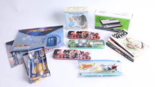 Mixed collection of three Doctor Who books, three Doctor Who pencil case tins, two plastic Doctor