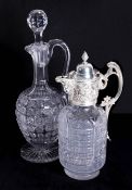 A silver-plated and ornate glass claret jug and a cut glass decanter.