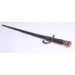 A 19th bayonet with metal scabbard, 66cm.