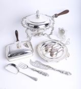 A silver plated ornate food warmer on spirit stand, together with other food warmers, serving