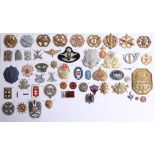 A collection of approx. 63 German, Austrian, Russian and other foreign military cap badges. Part