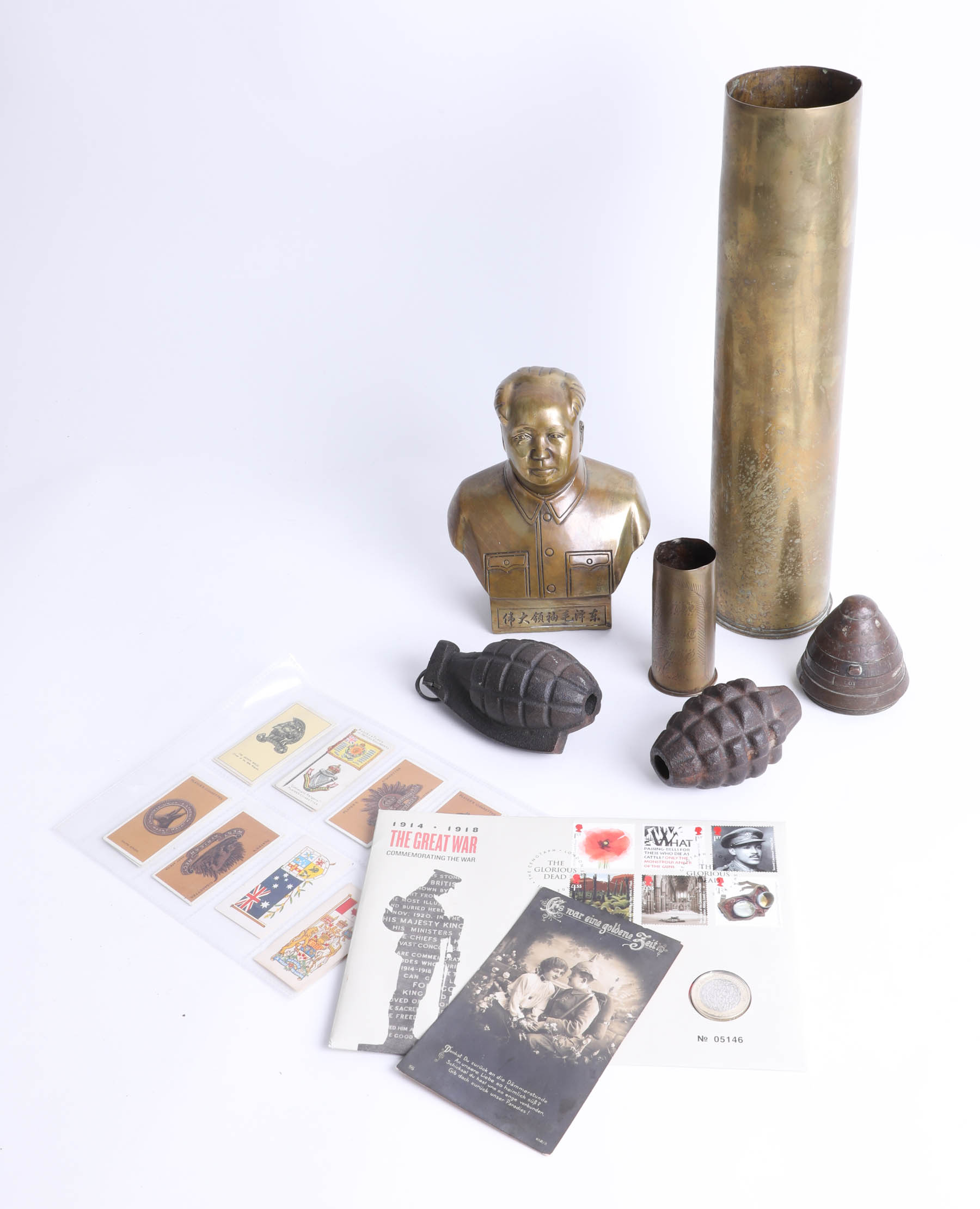 A collection of inert hand grenades, shell case and a brass bust of mayo Mao Tse Tung, some