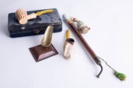 Two carved Meerschaum pipes, including one modelled in the form of an eastern head and a Bavarian