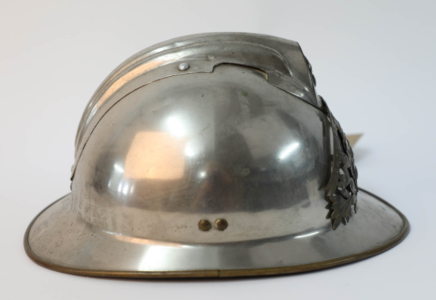 A French fireman's helmet, the crest marked Sapeurs Pompiers D'aulnoye and another helmet, marked - Image 3 of 15