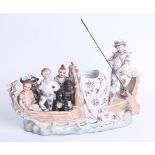 A 19th century porcelain figure group, natives on a boat, AF, marked 'HINN'
