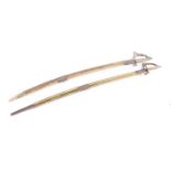 Two similar curved blade 20th century Indian dress swords with scabbards. Part of the Late