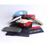 A collection of various caps and berets, including UN, Chinese and War vets. Part of the Late
