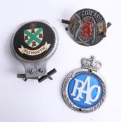 Three car badges RAC, Scotland and Plymouth.