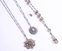 A stylish crystal pendant, together with a vintage necklace set with various citrine-type stones and