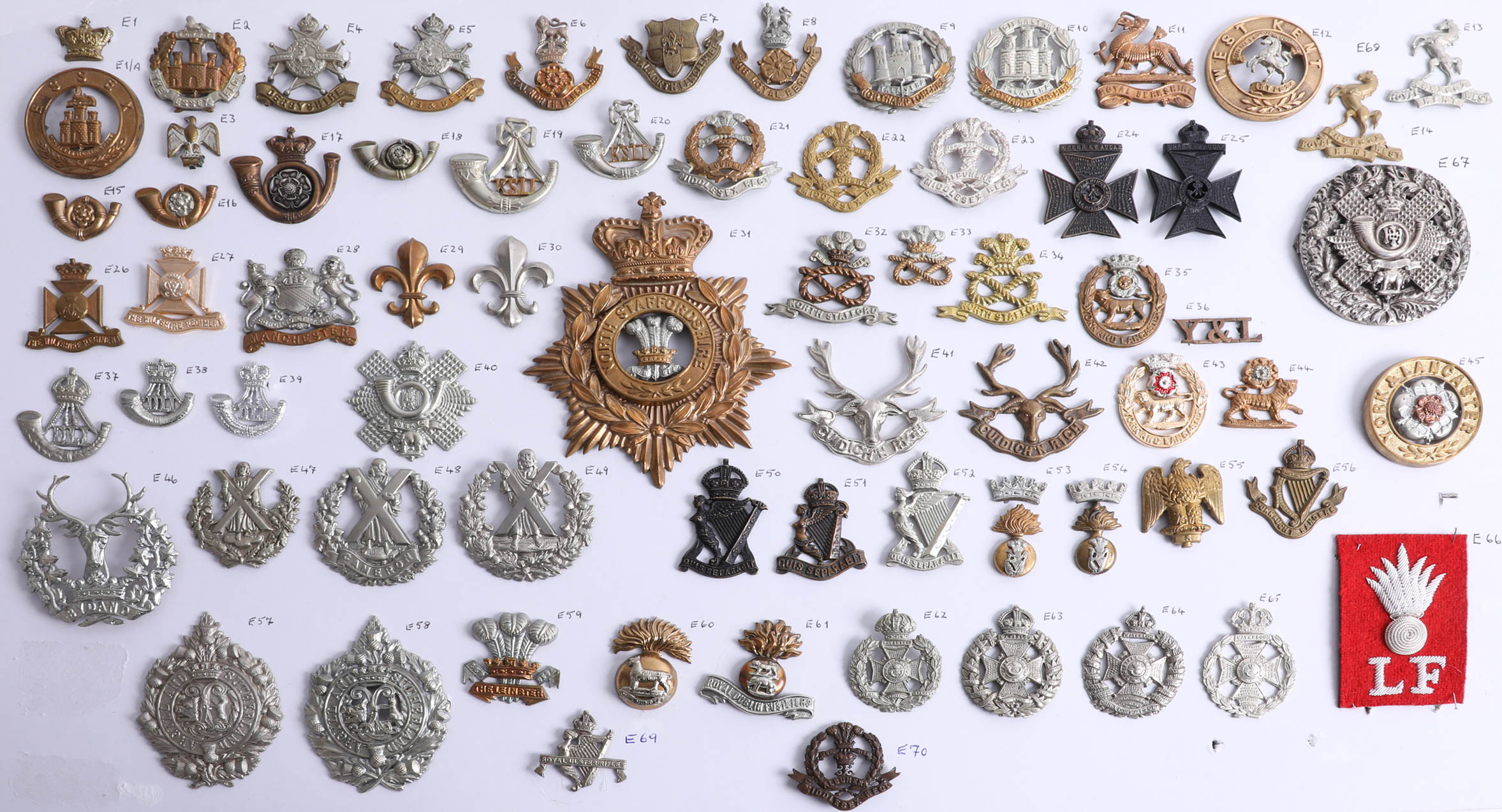 A collection of approx. 70 military cap badges, including Seaforth Highlanders, Highland Light