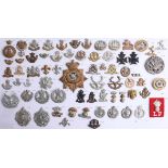 A collection of approx. 70 military cap badges, including Seaforth Highlanders, Highland Light