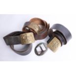 Three belts, with various military brass buckles and two other loose military buckles. Part of the