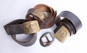 Three belts, with various military brass buckles and two other loose military buckles. Part of the