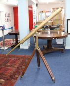 A 19th century brass, floor standing telescope marked 'Davis, London' on wooden adjustable tripod