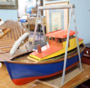 A small remote control fishing boat, scratch built with servo and carry handle, length 70cm.