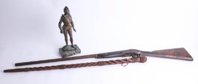 A carved wood rope style walking cane, length 91cm, 19th century shot gun for display only and a