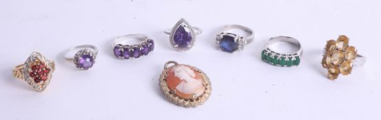 Collection of six various mainly silver dress rings marked TG Company and a cameo brooch.