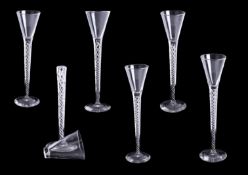 Set of six early 20th century air twist wine glasses (one broken), height 22cm.