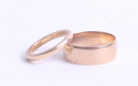 An 18ct wedding band (4.2g) and a 9ct band (4g).