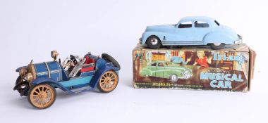 Triang Minic musical car, boxed together with Schuco 'Mercer' No.1225 clock work car, with key.