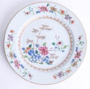 A Chinese porcelain single plate decorated with flowers, gilt border on a grey ground, 23cm