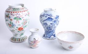 A Chinese porcelain vase decorated with butterflies and flowers (badly damaged) height 22cm, a small