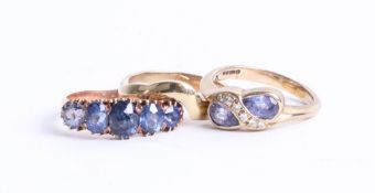 A 9ct gold tanzanite ring with 9ct gold band ring to match together with dress ring (3).