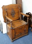 An oak Monk's seat, with fold over top.