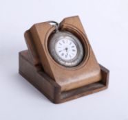 Silver fob watch in olive wood stand box.