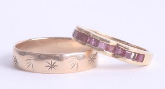 An 18ct yellow gold ruby ring and a 9ct gold band ring approx. 2.5g (2).