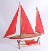 Model of yacht boat on stand, overall length 54cm.