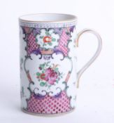 A Chinese? porcelain tankard / mug decorated with sprigs of flowers underglaze orange mark, height