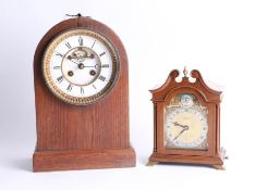 A mahogany cased mantle clock, the escapement visible on the dial, also an Elliott bracket clock