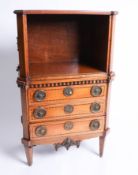 A continental satin wood bedside cabinet, fitted with three drawers, drop flap and shell inlaid,