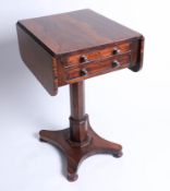 A 19th century rosewood work table on pedestal base.