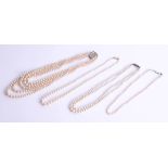 Four faux pearl necklaces, one set with a 14ct gold clasp (4).