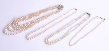 Four faux pearl necklaces, one set with a 14ct gold clasp (4).