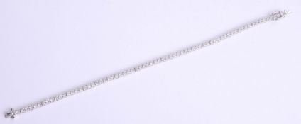 An 18ct diamond line bracelet, approximately 3.70ct, length 19cm.