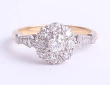 An 18ct diamond cluster ring, size I, 3.2g.