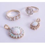 A collection of opal jewellery to include a 14k opal and diamond ring size W, a 9ct opal ring,
