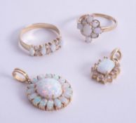 A collection of opal jewellery to include a 14k opal and diamond ring size W, a 9ct opal ring,