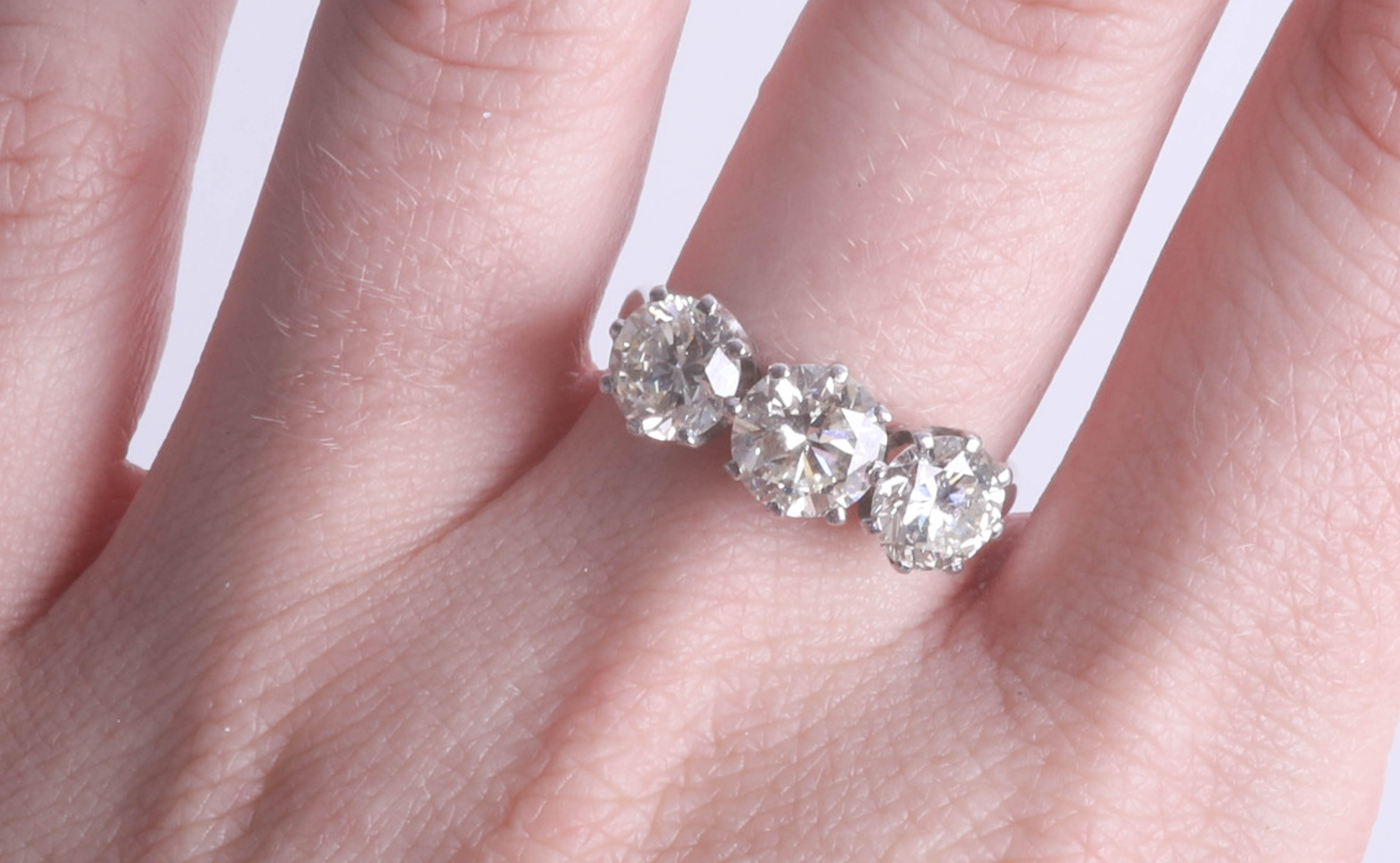 A fine diamond three stone ring, set in 18ct white gold, combined diamond weight approximately 3. - Image 2 of 7